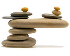 Balanced stones topped with a small golden stone